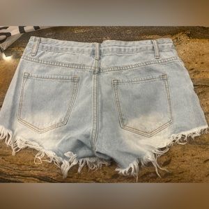 Women’s distressed denimJean shorts brand new never used
